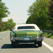 A retro green car - rear view